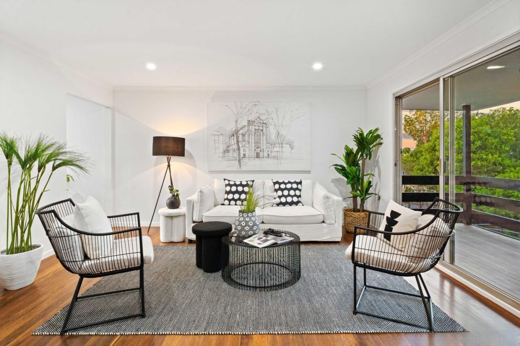 Light-filled living room with modern black and white styling