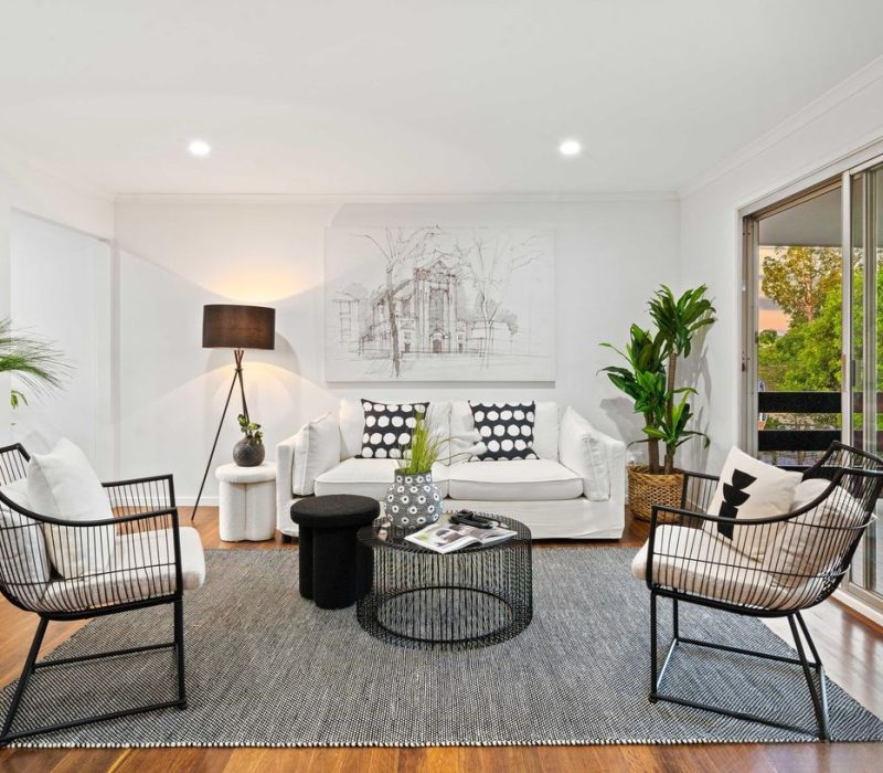 Contemporary Living Room with Indoor-Outdoor Flow Light-filled living room with modern black and white styling