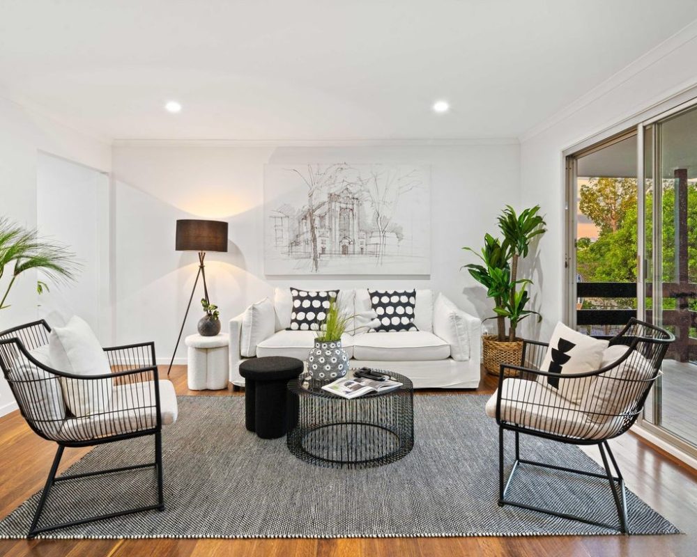 Light-filled living room with modern black and white styling