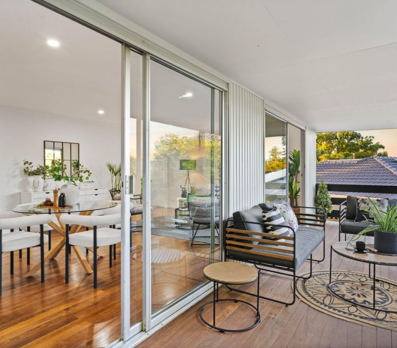 Indoor-Outdoor Flow with Deckside Dining Seamless indoor-outdoor dining area with deck access