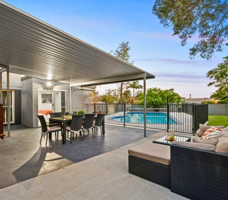 Outdoor entertaining area with poolside views
